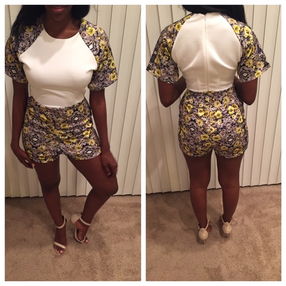 White romper with flower sleeves and bottom.