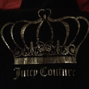 Black soft hoody with a silver design on back
