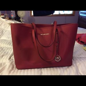 large red Michael Kors bag