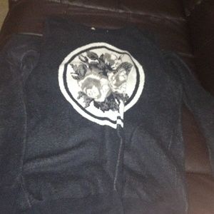 Black sweater with floral print in the middle