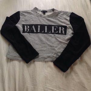 BALLER cropped sweater.