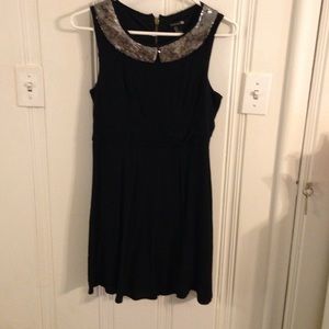 Black sleeveless dress with sequin collar