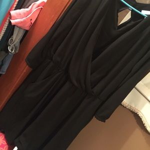 Cute, all black dress with pockets.