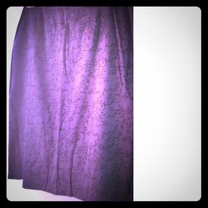 Nice purple skirt with embroidered floral print.