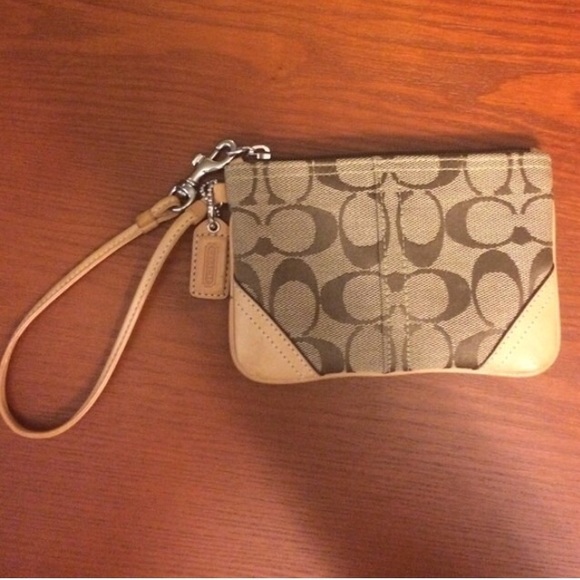 Brown and tan Coach wristlet