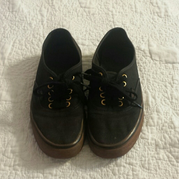 Black an goldish brown vans