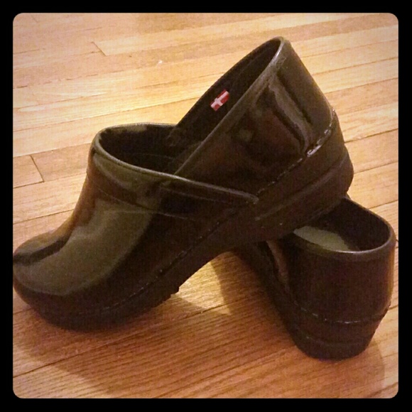 Sanita black patent leather clogs