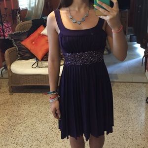 Semi-formal, deep purple dress.