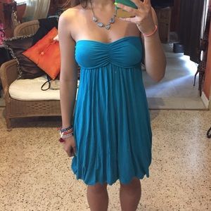 Teal strapless dress.