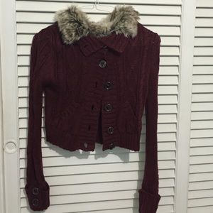 Cozy burgundy sweater with faux fur.