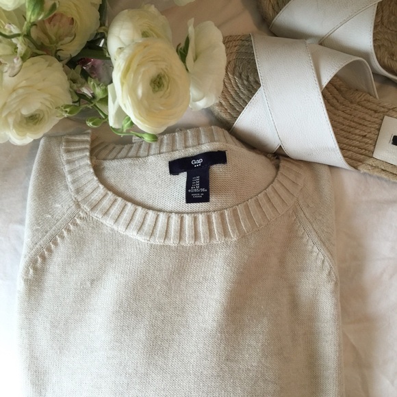 Cream crew neck sweater.