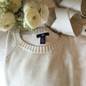 Cream crew neck sweater.