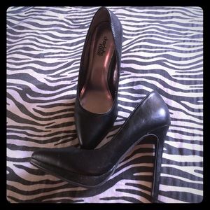Black leather pumps