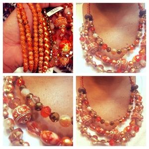 Handmade beaded necklace in shades of orange.