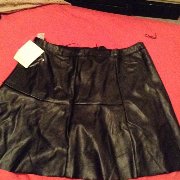 A black Leather Skater Skirt . 👜💄