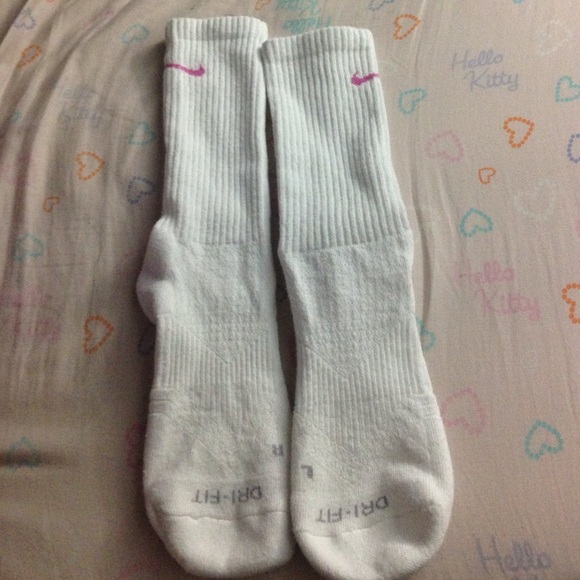 Nike white high socks with breast cancer swoosh.