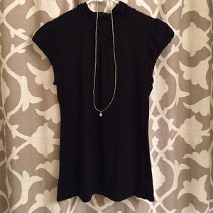 Dressy black shirt. Very cute and comfortable.