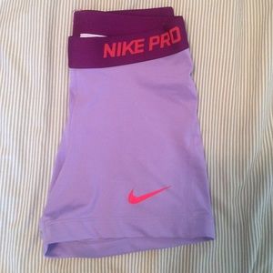purple Nike Pro With Orange Nike Symbol