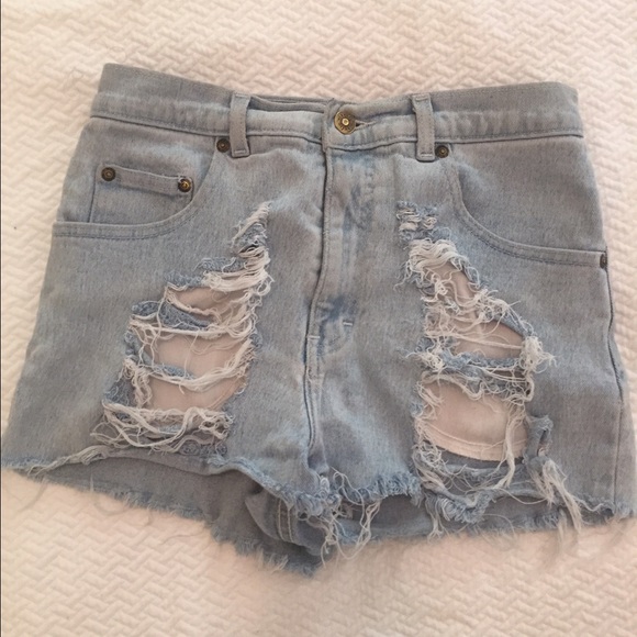 Light wash distressed denim shorts.