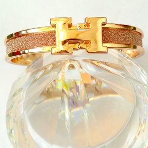 Gold over gold "H" click clack bracelet