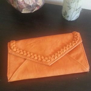 pretty rust coloured trifold wallet