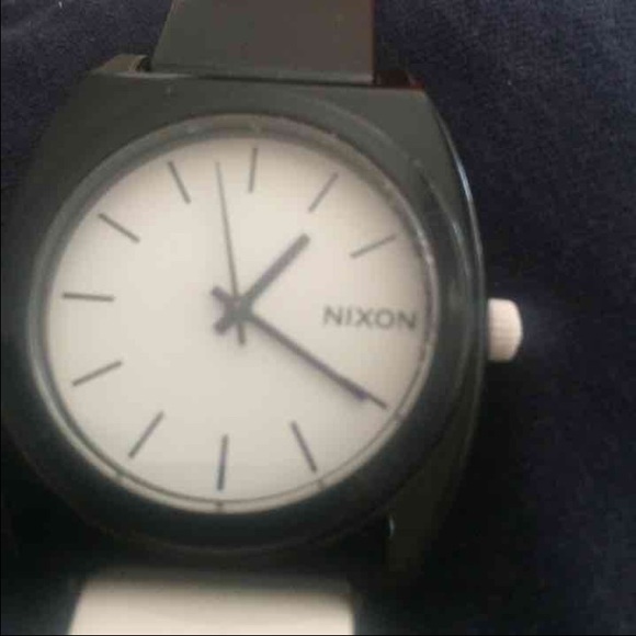 White and black Nixon watch