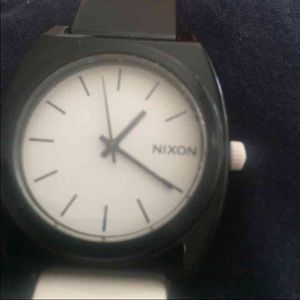White and black Nixon watch