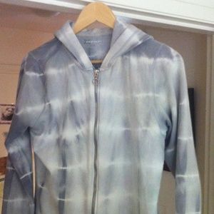 Grey and white zip up hoodie.