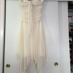 Cream dress with handkerchief hem