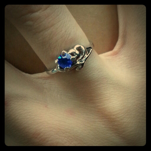 Silver plated swirl design with Blue CZ stone sz 5
