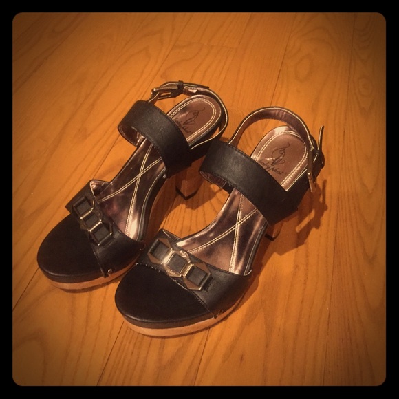 Baby Phat black strapped heals. Size 8
