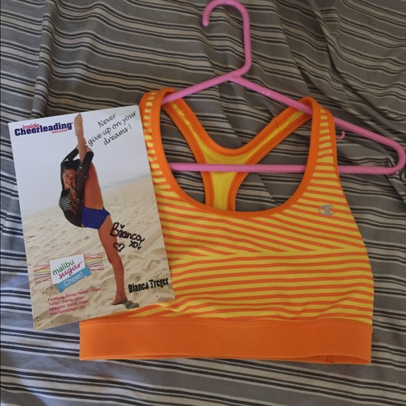 Orange sports bra and signed picture from Bianca