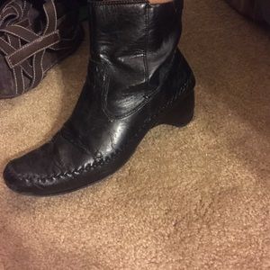 Low, black boots w/ wedge heel