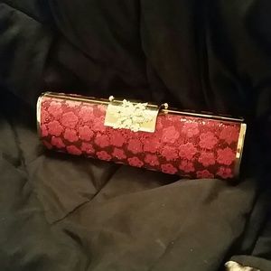 Hard case pink and gold clutch