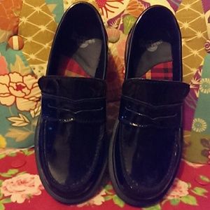 Dr. Martens Clara patent leather penny loafers.