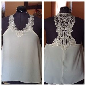 Ivory appliqué top.