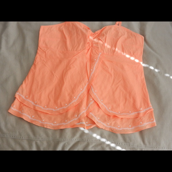 Cute pale orange top with embroidered details