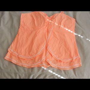 Cute pale orange top with embroidered details