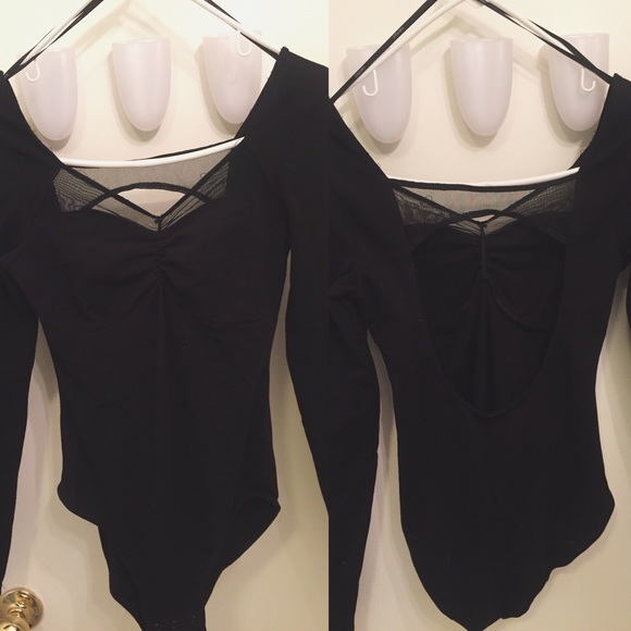 Black mesh body suit.