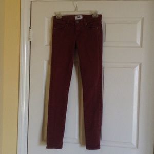 Paige brick colored denim skinny jeans.