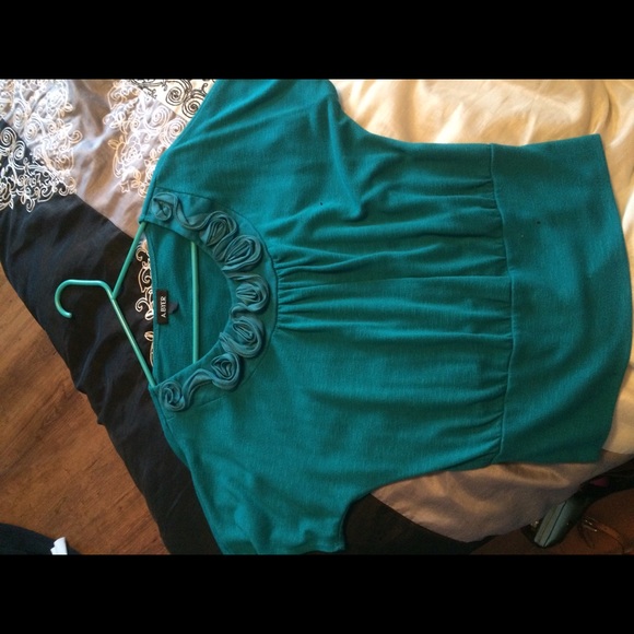 Teal top with rose design on neckline