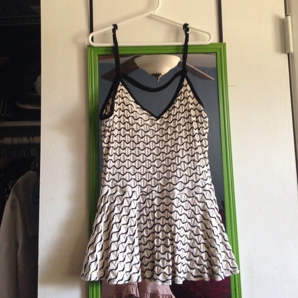 Cream and black open back peplum tank top