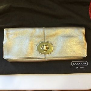 Coach gold leather fold over clutch