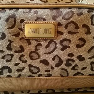 Jennifer Lopez rolling tan leopard duffle bag