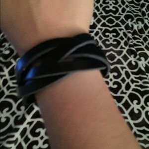 Black leather bracelet.