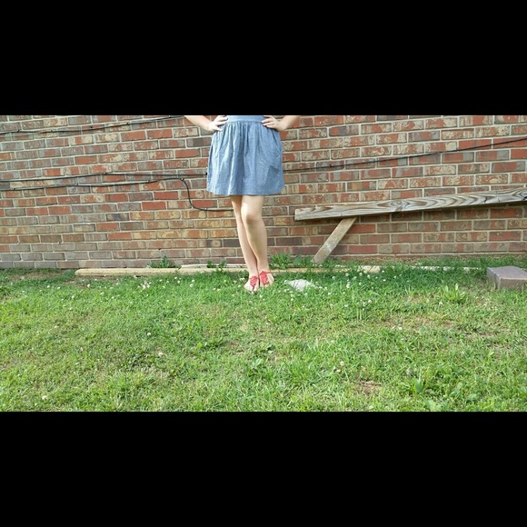 Greyish denim skirt, not heavy.