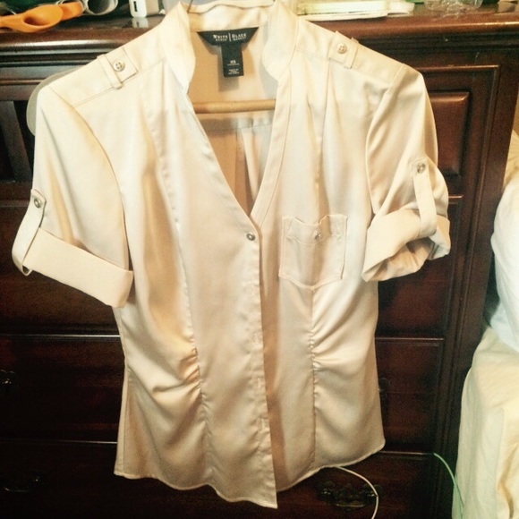 Beautiful details on this beige silky blouse