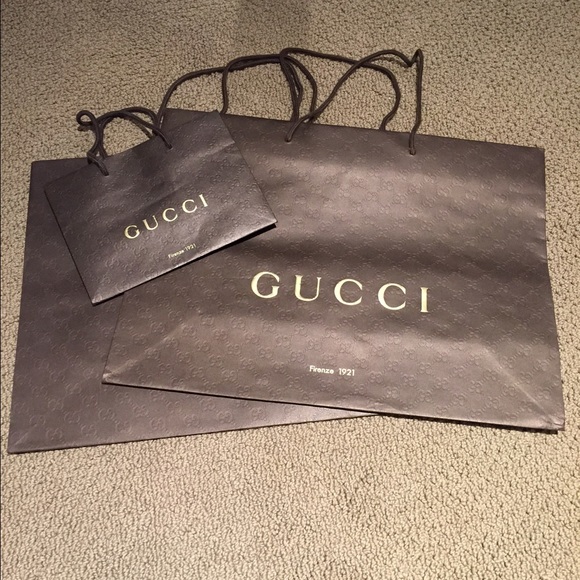 Three authentic Gucci shopping bags