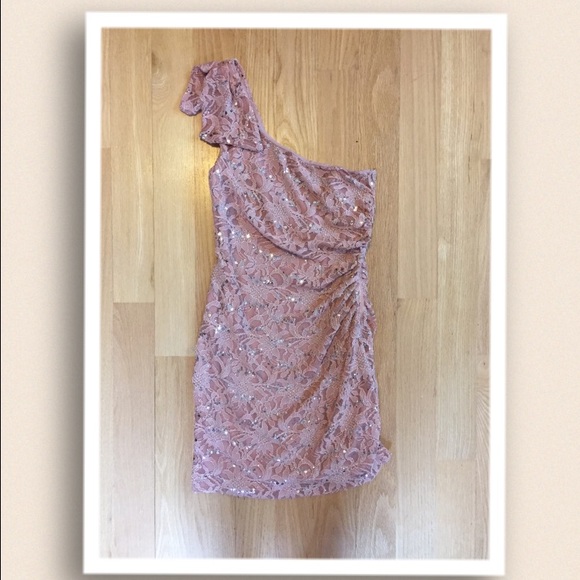 Light pink one shoulder dress.