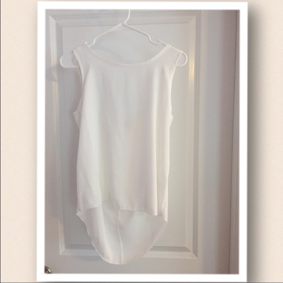 High-low white top with bow detail.